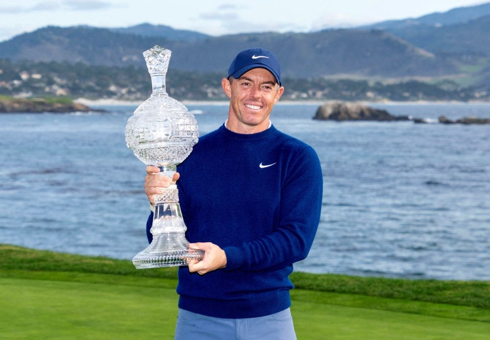 Rory McIlroy hoists the trophy during the final round of the AT&T Pebble Beach Pro-Am golf tournament at Pebble Beach Golf Links, Pebble Beach, California, February 2, 2025. — Kyle Terada-Imagn Images via Reuters 