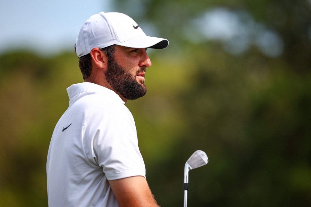 Scottie Scheffler watches a tee shot on the 17th hole during the third round of the RBC Heritage at Harbour Town Golf Links on April 20, 2024 in Hilton Head Island, South Carolina. — AFP pic 