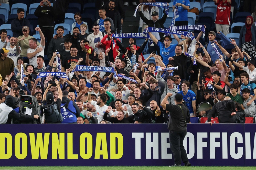 Lion City Sailors' fans celebrate the qualification for the final after the AFC Champions League Two semi-final second leg football match. — AFP pic