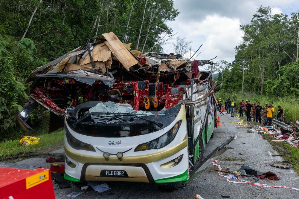 The wreckage of the bus involved in a horrific accident that claimed the lives of 15 Universiti Pendidikan Sultan Idris (UPSI) students at KM53 of the East-West Highway near Gerik . — Bernama pic
