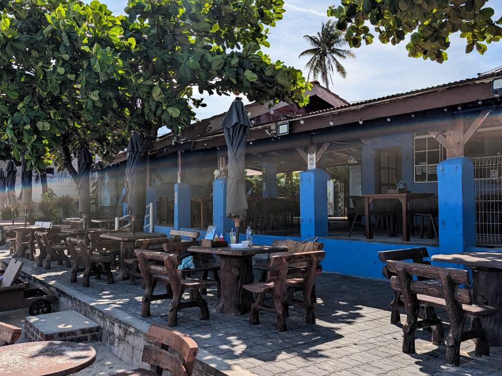 A fresh coat of blue paint and a few new sun loungers, but still the same relaxed island feel. — Picture by Ethan Lau