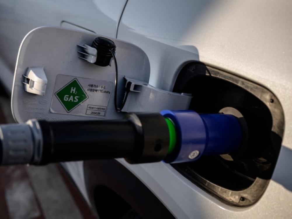 A car being refuelled at a station for hydrogen powered vehicles in Seoul. ― AFP pic