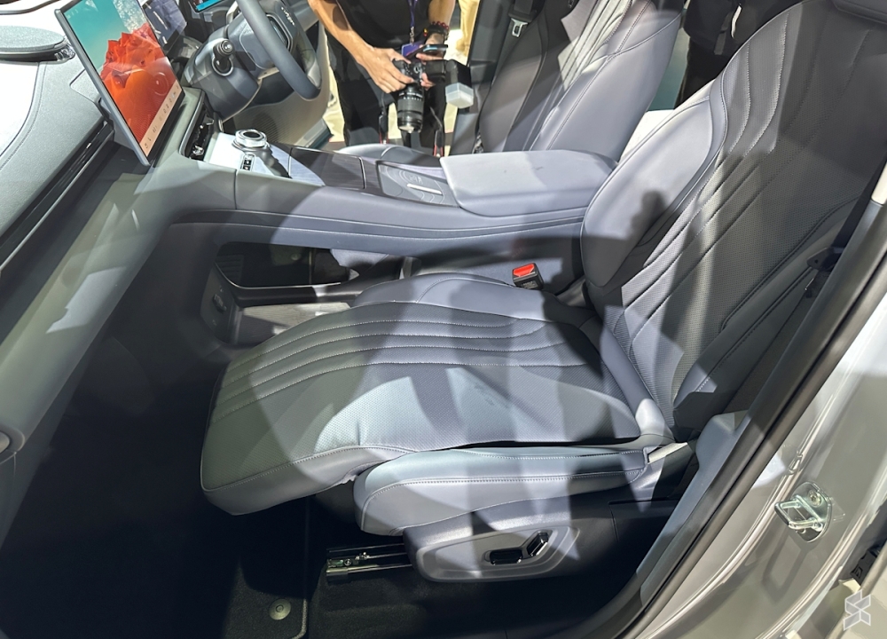 A reclinable front passenger seat with an extendable leg rest is among the Premium Plus variant's standout upgrades. — SoyaCincau pic