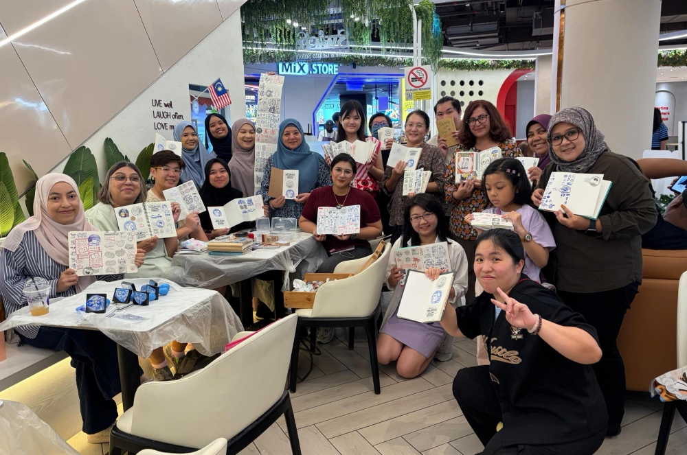 Members of the Malaysia Stamp Hunt Community pose for a group photo during a gathering of stamp enthusiasts. — Picture courtesy of the Malaysia Stamp Hunt Community