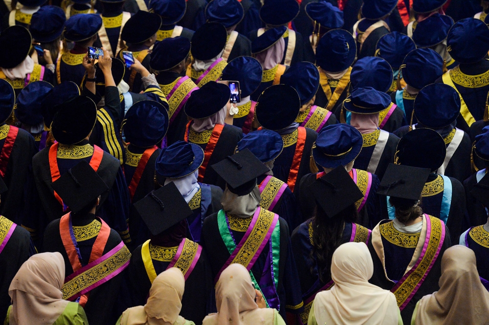Universities and colleges should treat out of campus transition as seriously as they treat the transition in. — Picture by Miera Zulyana