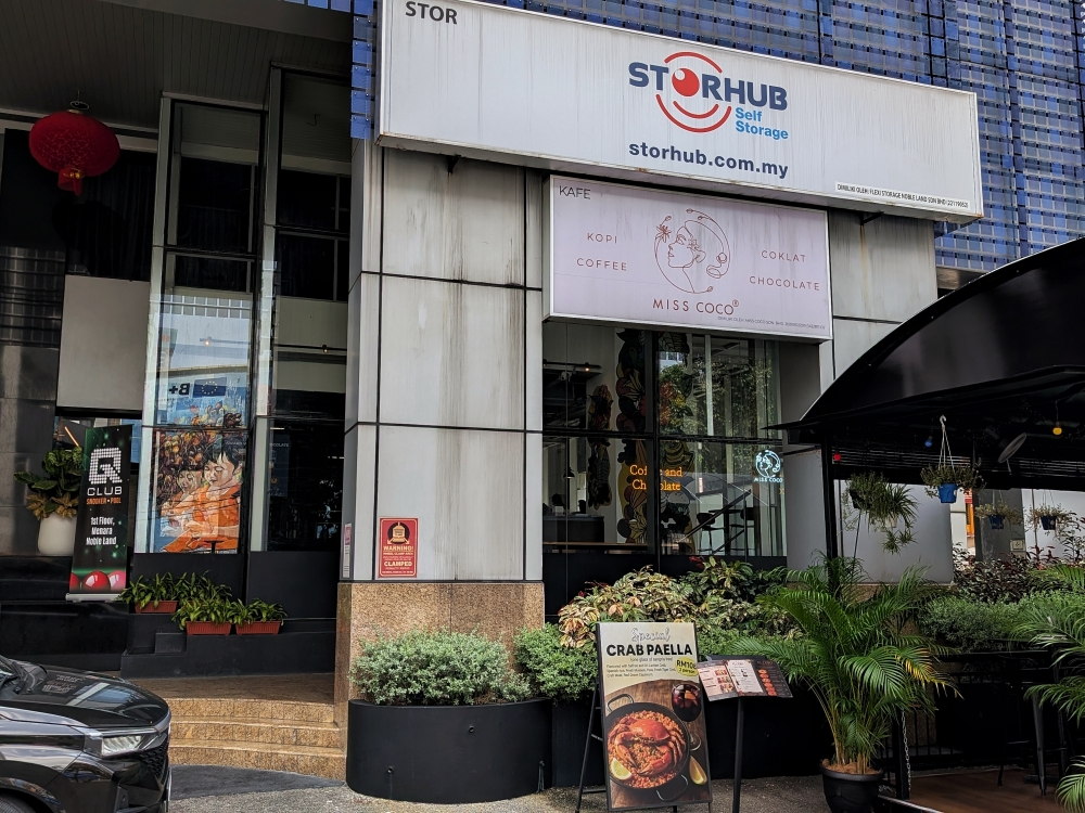 The sign can be hard to spot, but head into Menara Noble Land, and you’ll find Miss Coco Cafe to the right of the entrance. — Picture by Ethan Lau