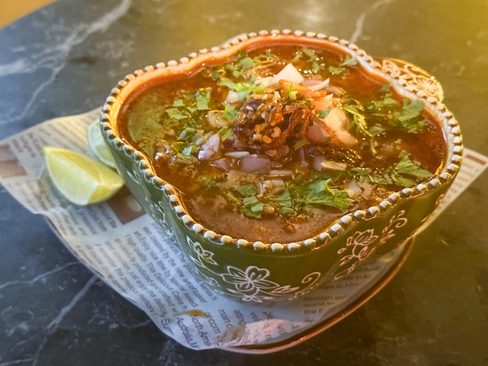 Soup up with the fiery red-chili Pozole Rojo de Cerdo to warm your stomach as you drink the night away here. — Picture by Lee Khang Yi