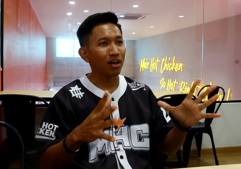 Muiz Hot Chicken founder Muhamad Muizzuddin Remle, 33, speaks to Bernama during a recent interview at his restaurant in Pagoh Jaya. — Bernama pic 