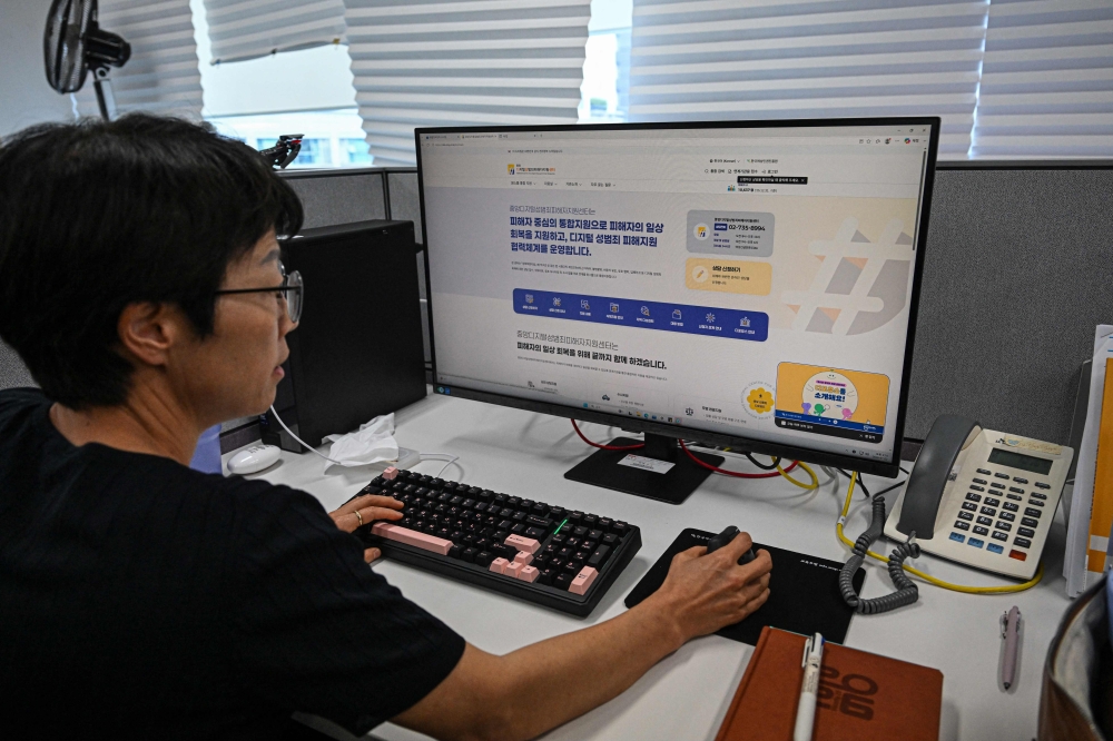 Kim Mi‑Soon, head of the National Centre for Digital Sexual Crime Response, browses the centre’s internal website in Seoul on July 2, 2026. — AFP pic