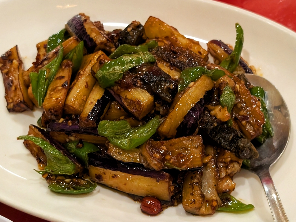 Eggplant wok-fried with century egg, peanuts and screw peppers. — Picture by Ethan Lau