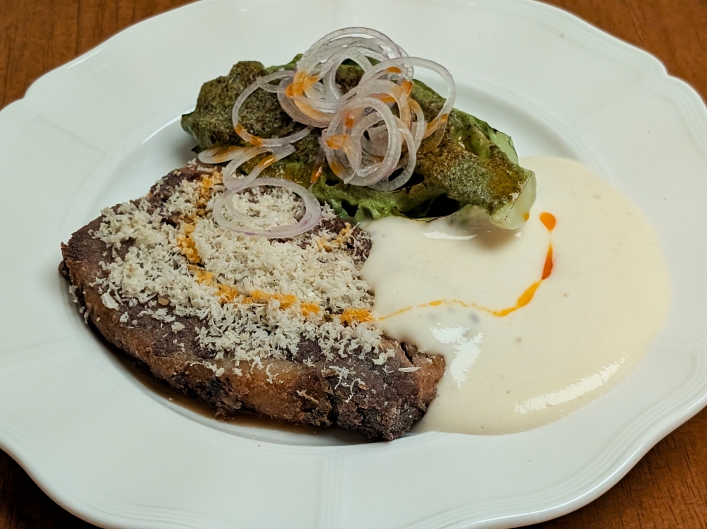 The beef brisket is braised, then deep-fried, with lots of horseradish shaved on top. — Picture by Ethan Lau