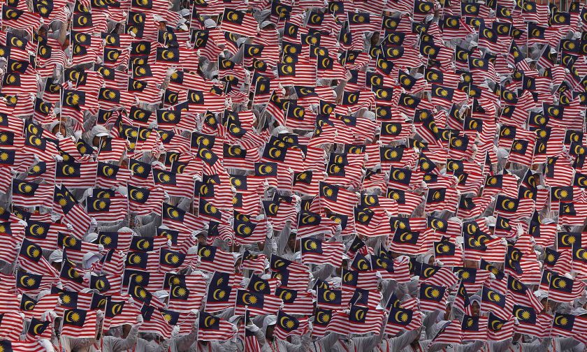 People wave national flags during Independence Day, or Merdeka Day, celebrations in Kuala Lumpur August 31, 2014. u00e2u20acu2022 Reuters pic