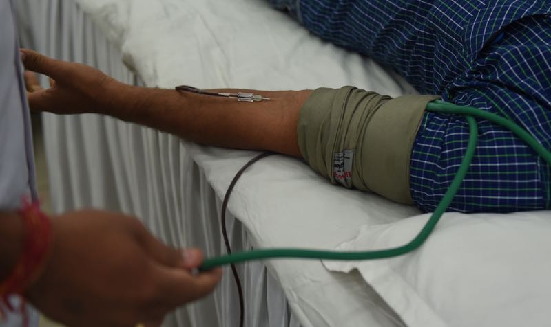 In this file photograph taken on September 24, 2015, an Indian volunteer donates blood during a blood donation camp in New Delhi. u00e2u20acu201d AFP pic