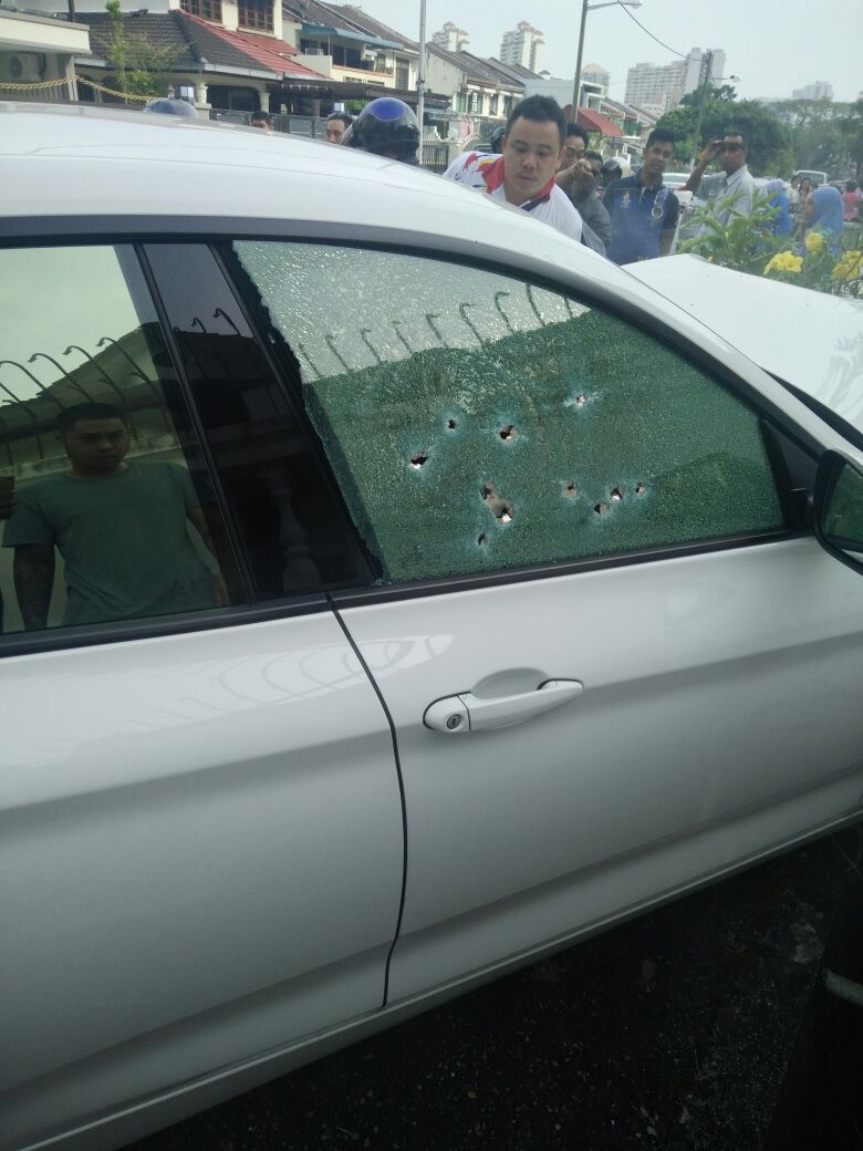 The driver’s window riddled with bullet holes. — NewsPulse pic