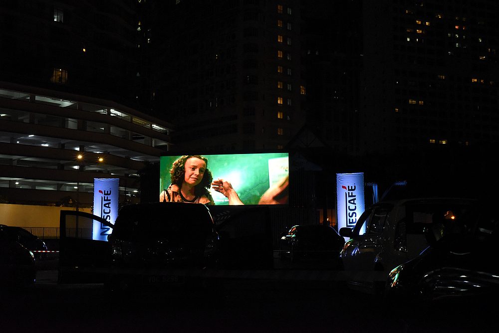 Attendees get to sit back and relax in the comfort of their own car while enjoying a movie being screened. — Picture by Arif Zikri
