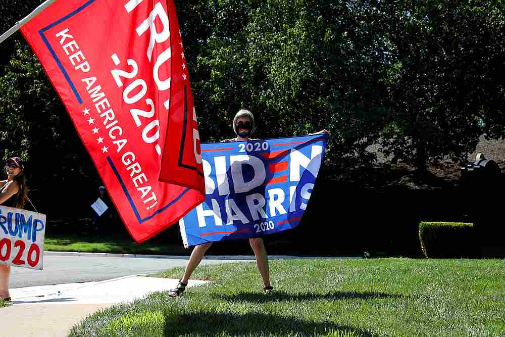 US President Donald Trump and Democratic US presidential nominee Joe Biden supporters gather outside while Trump plays golf at Trump National Golf Club in Sterling, Virginia September 5, 2020. u00e2u20acu201d Reuters pic