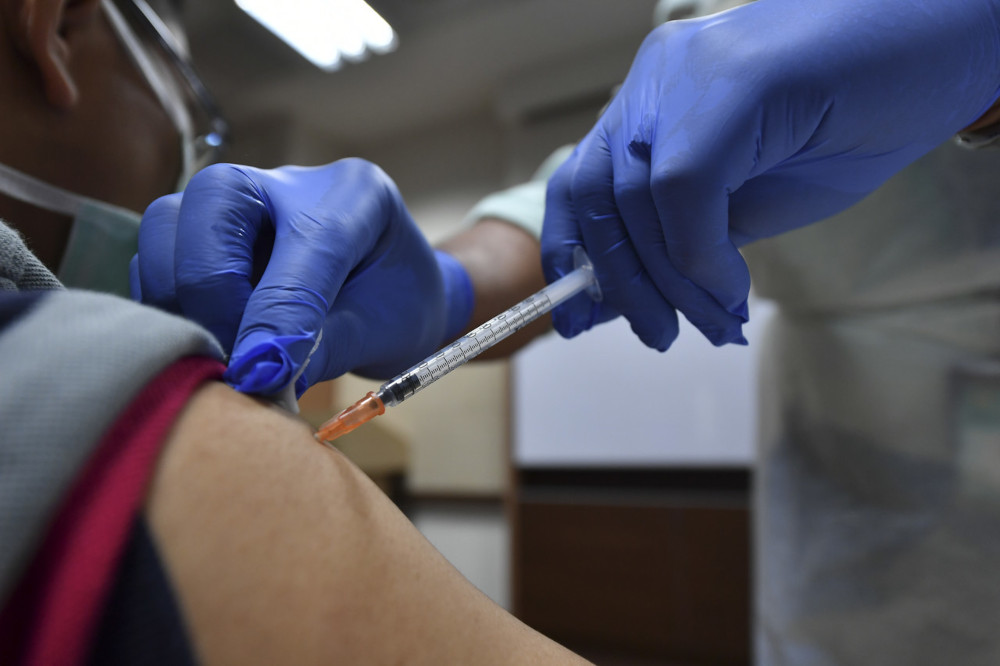 A frontliner receives a dose of the Pfizer-BioNTech Covid-19 vaccine from a low dead volume syringe in Putrajaya, March 1, 2021. u00e2u20acu201d Bernama pic 