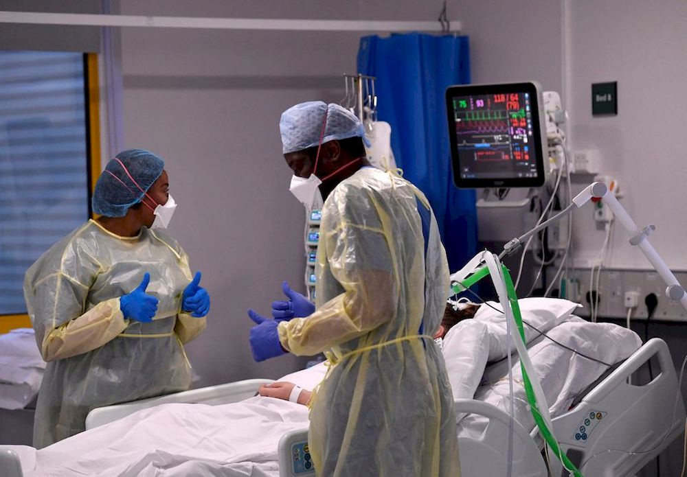 Nurses react as they treat a Covid-19 patient in the ICU (Intensive Care Unit) at Milton Keynes University Hospital, amid the spread of the coronavirus disease pandemic, Milton Keynes, Britain, January 20, 2021. u00e2u20acu201d Reuters pic