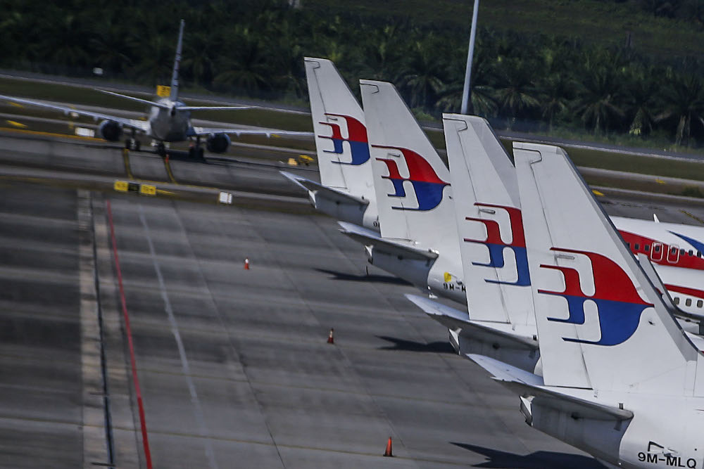 The queue of planes at Kuala Lumpur International Airport is scheduled to take off only at certain times since Malaysia was hit by the Covid-19 pandemic October 17, 2021. u00e2u20acu2022 Picture by Hari Anggara 