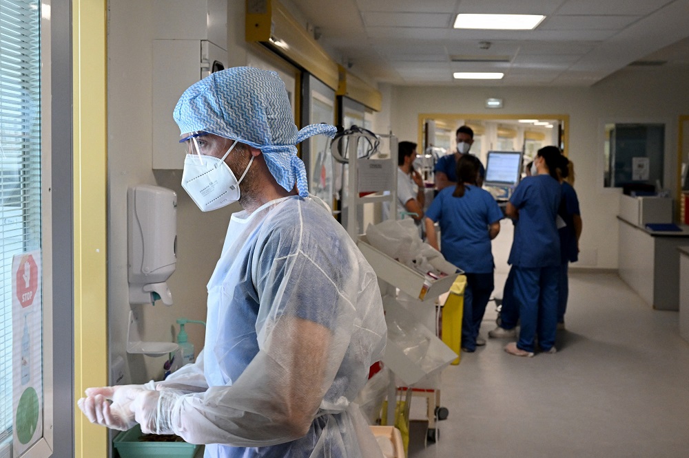 The WHO has warned that the sheer numbers of people infected will mean many vulnerable people are still falling seriously ill and dying. u00e2u20acu201d AFP pic