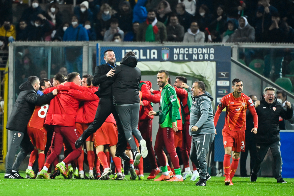 North Macedoniau00e2u20acu2122s players and staff celebrate at the end of the 2022 World Cup qualifying play-off football match between Italy and North Macedonia, March 24, 2022 at the Renzo-Barbera stadium in Palermo. u00e2u20acu201d AFP picn