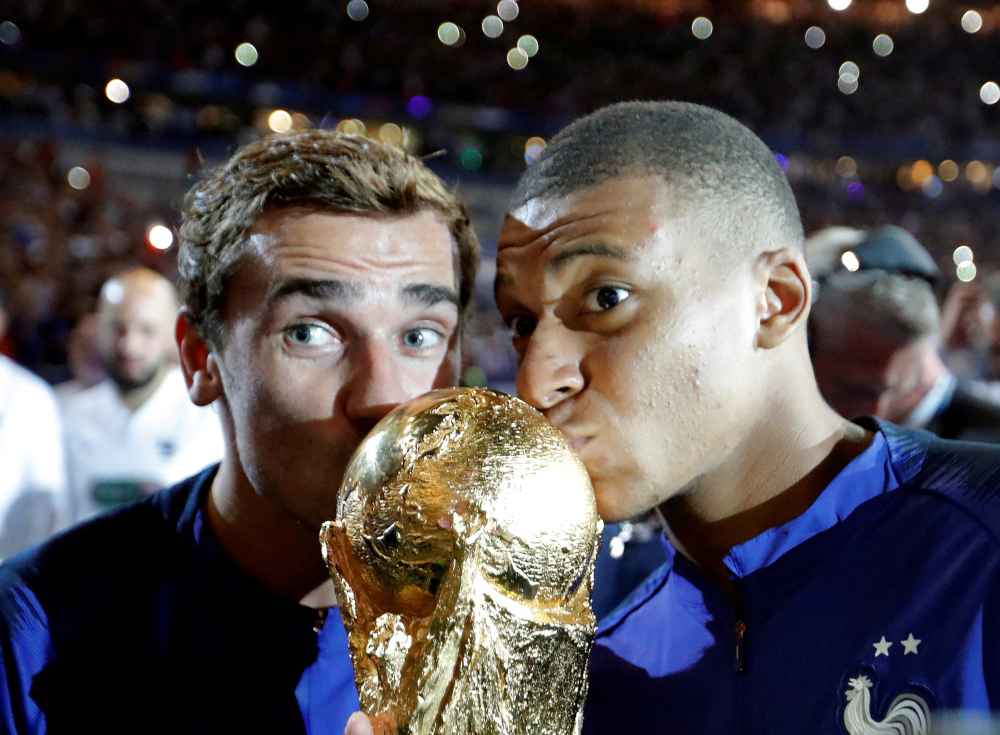 Franceu00e2u20acu2122s Kylian Mbappe and Antoine Griezmann celebrate with the World Cup trophy during a ceremony after the match against Netherlands at Stade de France, Saint-Denis, France, September 9, 2018. u00e2u20acu201d Reuters pic 