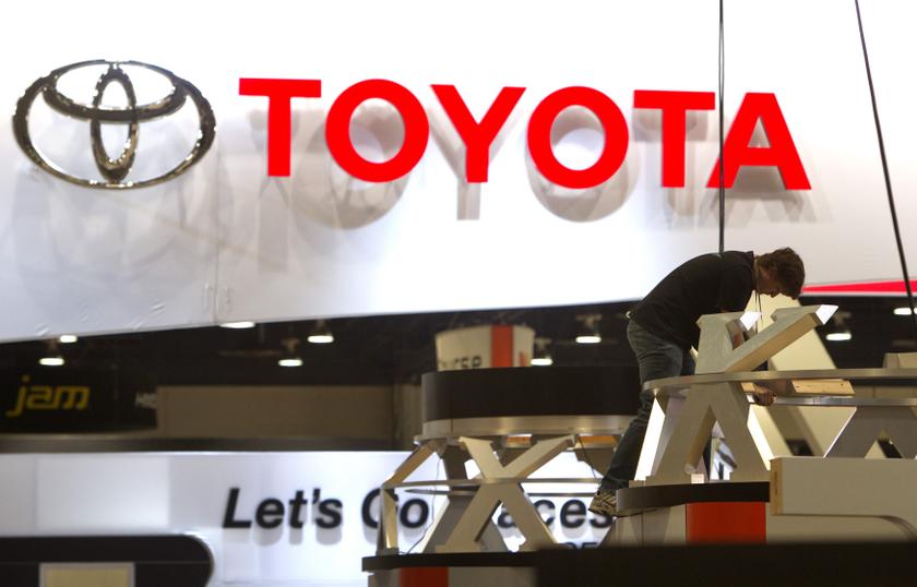 A worker sets up a display near the Toyota booth in preparation for the 2014 Consumer Electronics Show (CES) at the Las Vegas Convention Center in Las Vegas, Nevada, January 4, 2014. u00e2u20acu201d Reuters pic