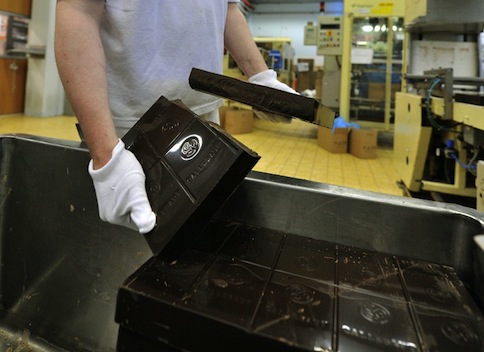 An employee tests a five kilos chocolate bar at the Barry Callebaut chocolate factory in Wieze, Belgium, on July 8, 2013. u00e2u20acu201d AFP pic