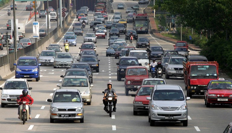 Vehicles drive on a highway in Kuala Lumpur, 20 April 2005. u00e2u20acu201d AFP pic